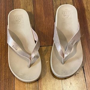 Girls rose gold REEF flip flops